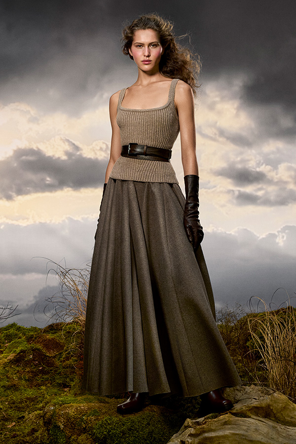 Max Mara Untamed Heroine campaign look with top, belt and hazelnut brown wide-fit skirt with black gloves. 